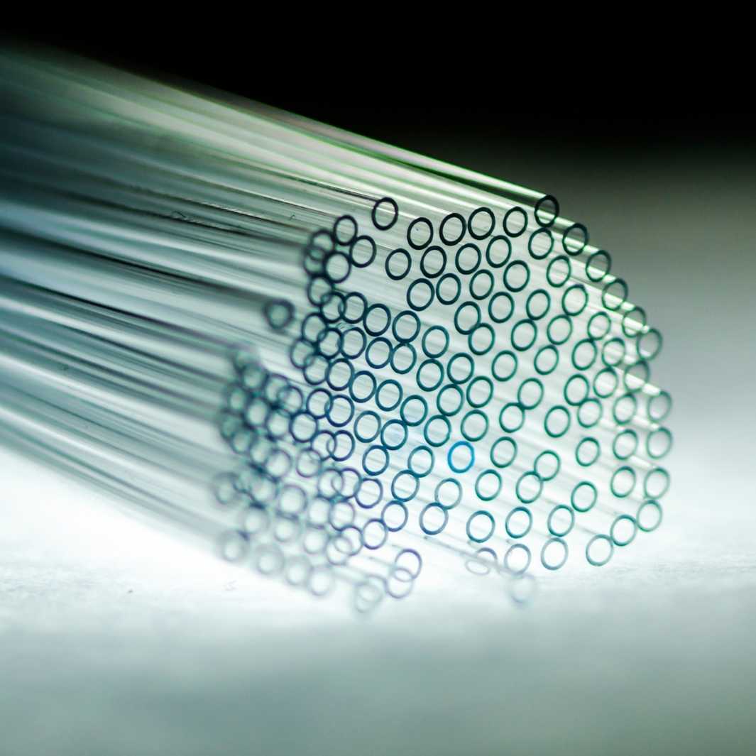 Lengths of glass tube cut to be made into glass straws.
