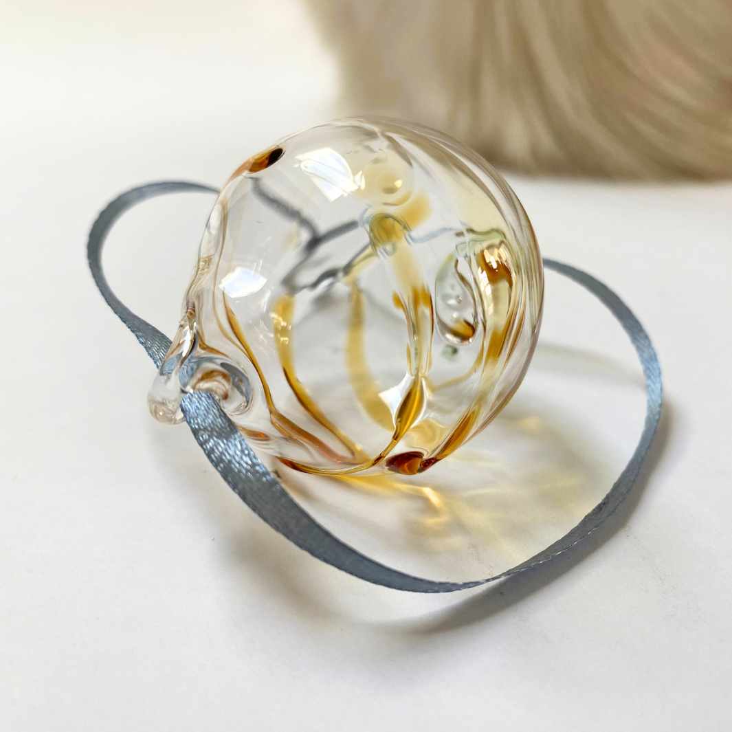 Wearing-Glass-Christmas-Bauble-Amber-Swirl